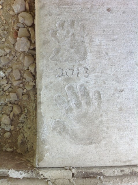 Amelia and Eli's handprints in the new RV pad